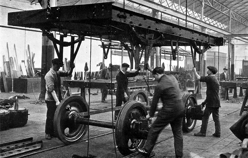 Photo of Lowering Underframe on to Wheels.